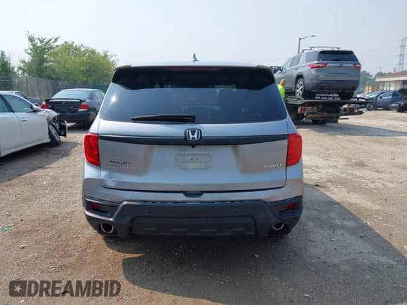 2023 Honda Passport EX-L with VIN 5FNYF8H50PB019594, listed as a IAAI auction lot 42882366 with 26,120 mi miles and . Bid and sale history available at DreamBid. Image 16.