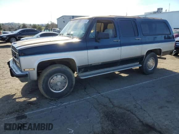 1991 Chevrolet Suburban с VIN 1GNGV26K1MF104219, выставлен на аукционе Copart как лот 87527045 с пробегом 189 345 миль миль и Чистый • Clean title. История ставок и продаж доступна на DreamBid. Изображение 1.