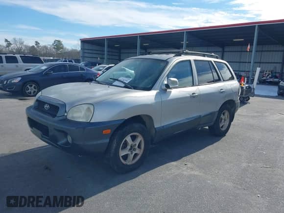 2002 Hyundai Santa Fe GLS with VIN KM8SC13D42U202223, listed as a IAAI auction lot 41338701 with 228,620 mi miles and . Bid and sale history available at DreamBid. Image 2.