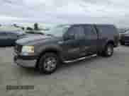 2005 Ford F-150 XLT with VIN 1FTPX12575NA85342, listed as a Copart auction lot 82204225 with 221,143 mi miles and Salvage title. Bid and sale history available at DreamBid. Image 1.