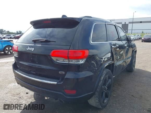 2015 Jeep Grand Cherokee Overland with VIN 1C4RJECG3FC841263, listed as a IAAI auction lot 43293918 with 158,583 mi miles and . Bid and sale history available at DreamBid. Image 4.
