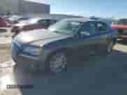 2014 Chrysler 300 C with VIN 2C3CCAKGXEH260448, listed as a Copart auction lot 72676464 with 140,450 mi miles and Salvage title. Bid and sale history available at DreamBid. Image 1.