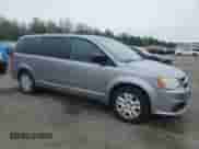 2014 Dodge Grand Caravan American Value with VIN 2C4RDGBG2ER141177, listed as a Copart auction lot 58329325 with 230,825 mi miles and Clean title. Bid and sale history available at DreamBid. Image 4.