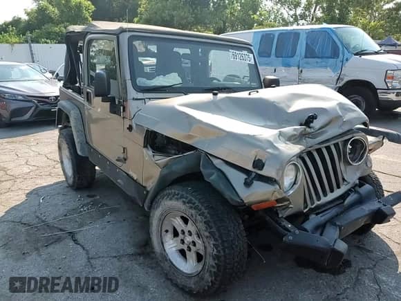 2004 Jeep Wrangler SE with VIN 1J4FA29144P735859, listed as a Copart auction lot 69126375 with 148,557 mi miles and Salvage title. Bid and sale history available at DreamBid. Image 13.