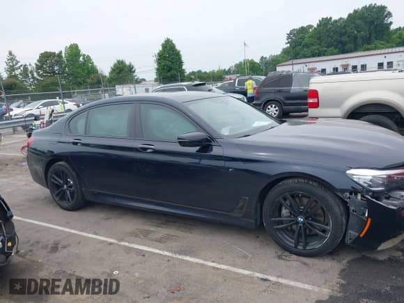 2019 BMW 7 Series 740i xDrive with VIN WBA7E4C54KGV28663, listed as a IAAI auction lot 42282060 with 73,109 mi miles and . Bid and sale history available at DreamBid. Image 13.