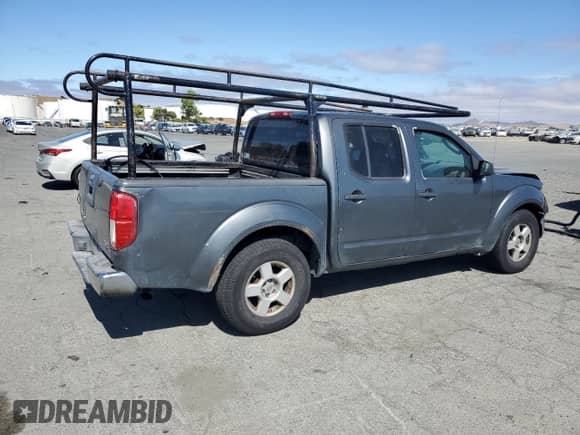 2006 Nissan Frontier SE with VIN 1N6AD07U36C427985, listed as a Copart auction lot 65688815 with 327,628 mi miles and Salvage title. Bid and sale history available at DreamBid. Image 3.