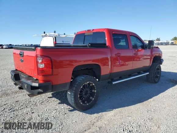 2009 Chevrolet Silverado 1500 LTZ with VIN 3GCEK33339G230826, listed as a Copart auction lot 71809015 with 198,069 mi miles and Salvage title. Bid and sale history available at DreamBid. Image 3.