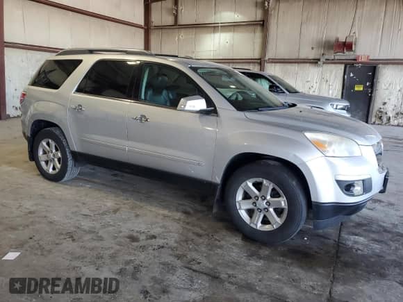 2009 Saturn Outlook XR with VIN 5GZER23D99J123212, listed as a Copart auction lot 64200245 with 145,969 mi miles and Salvage title. Bid and sale history available at DreamBid. Image 4.
