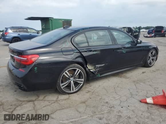 2019 BMW 7 Series 740i xDrive with VIN WBA7E4C55KGV70002, listed as a Copart auction lot 66395815 with 128,606 mi miles and Salvage title. Bid and sale history available at DreamBid. Image 3.