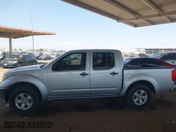 2009 Nissan Frontier SE z VIN 1N6AD07U59C405247, wystawiony jako IAAI lot #42821636 z przebiegiem 164 946 mil mil oraz . Historia ofert i sprzedaży dostępna na DreamBid. Obrazek 13.