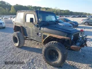 2002 Jeep Wrangler X with VIN 1J4FA39S62P743974, listed as a IAAI auction lot 43123472 with 138,914 mi miles and . Bid and sale history available at DreamBid. Image 1.