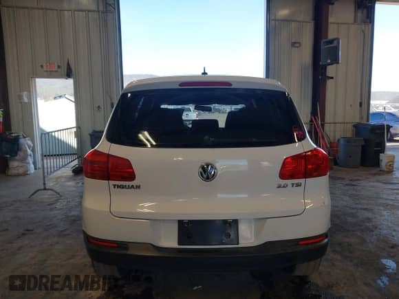 2013 Volkswagen Tiguan with VIN WVGCV3AX7DW605594, listed as a IAAI auction lot 42057457 with 131,629 mi miles and . Bid and sale history available at DreamBid. Image 16.