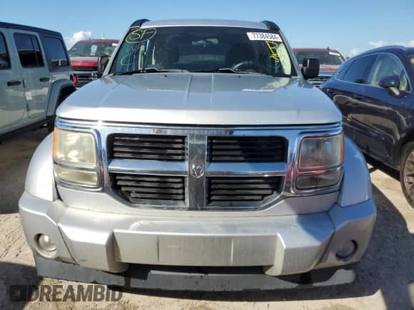 2011 Dodge Nitro SE с VIN 1D4PT2GK1BW587062, выставлен на аукционе Copart как лот 77384584 с пробегом 120 977 миль миль и На запчасти • Non repairable. История ставок и продаж доступна на DreamBid. Изображение 5.