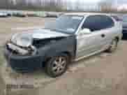 2004 Hyundai Accent GL z VIN KMHCG35C64U279929, wystawiony jako Copart lot #81661824 z przebiegiem 99 222 mil mil oraz Szkoda całkowita • Salvage title. Historia ofert i sprzedaży dostępna na DreamBid. Obrazek 1.