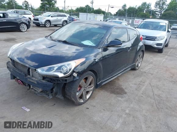2013 Hyundai Veloster Turbo z VIN KMHTC6AE5DU110652, wystawiony jako IAAI lot #42486326 z przebiegiem Nie podano mil oraz . Historia ofert i sprzedaży dostępna na DreamBid. Obrazek 2.