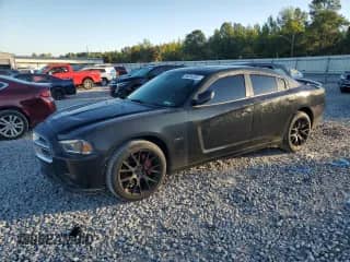 2011 Dodge Charger RT with VIN 2B3CL5CT1BH504113, listed as a Copart auction lot 86634265 with 168,499 mi miles and Salvage title. Bid and sale history available at DreamBid. Image 1.