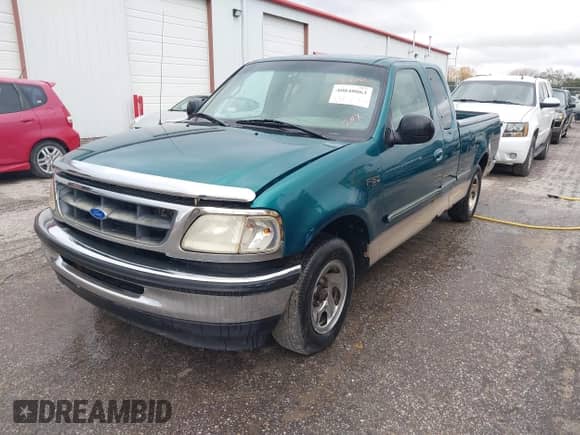 1997 Ford F-150 XL with VIN 1FTEX17LXVNC32588, listed as a IAAI auction lot 40848063 with 210,113 mi miles and . Bid and sale history available at DreamBid. Image 2.