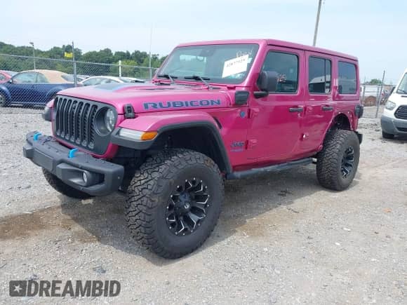 2022 Jeep Wrangler Unlimited Rubicon with VIN 1C4JJXR69NW125567, listed as a IAAI auction lot 42877525 with 28,098 mi miles and . Bid and sale history available at DreamBid. Image 2.