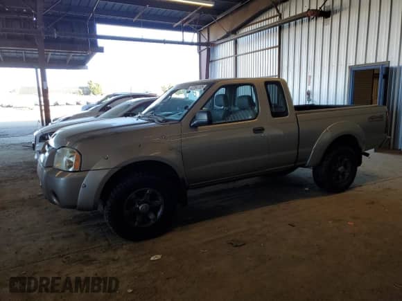 2003 Nissan Frontier XE z VIN 1N6ED26Y43C421206, wystawiony jako Copart lot #42264105 z przebiegiem 117 879 mil mil oraz Szkoda całkowita • Salvage title. Historia ofert i sprzedaży dostępna na DreamBid. Obrazek 1.