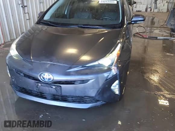 2018 Toyota Prius Two Eco z VIN JTDKARFU8J3065635, wystawiony jako Copart lot #84043455 z przebiegiem 113 173 mil mil oraz Czysty tytuł • Clean title. Historia ofert i sprzedaży dostępna na DreamBid. Obrazek 13.