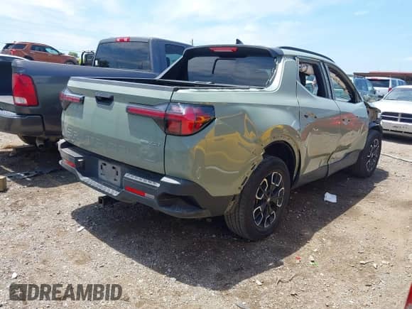 2023 Hyundai Santa Cruz SEL Premium z VIN 5NTJDDAF1PH051282, wystawiony jako IAAI lot #42725019 z przebiegiem 70 082 mil mil oraz . Historia ofert i sprzedaży dostępna na DreamBid. Obrazek 4.