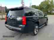 2017 Chevrolet Suburban Premier with VIN 1GNSKJKCXHR240591, listed as a Copart auction lot 84829265 with 305,907 mi miles and Clean title. Bid and sale history available at DreamBid. Image 4.
