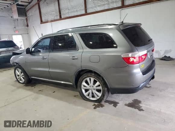 2012 Dodge Durango Crew with VIN 1C4RDJDG7CC163398, listed as a Copart auction lot 81640595 with 123,839 mi miles and Salvage title. Bid and sale history available at DreamBid. Image 2.