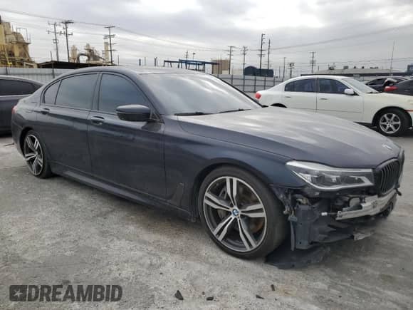 2019 BMW 7 Series 750i with VIN WBA7F0C57KGM24657, listed as a Copart auction lot 84496664 with 105,864 mi miles and Salvage title. Bid and sale history available at DreamBid. Image 4.