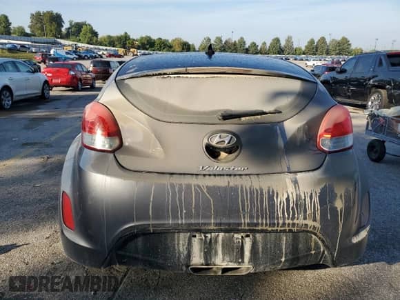 2013 Hyundai Veloster w/Black Int z VIN KMHTC6AD1DU130100, wystawiony jako Copart lot #83947425 z przebiegiem 155 402 mil mil oraz Szkoda całkowita • Salvage title. Historia ofert i sprzedaży dostępna na DreamBid. Obrazek 6.
