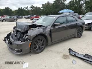 2023 Chrysler 300 Touring L с VIN 2C3CCADGXPH552410, выставлен на аукционе Copart как лот 84476105 с пробегом 31 139 миль миль и Списание • Salvage title. История ставок и продаж доступна на DreamBid. Изображение 1.