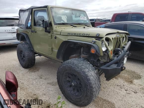2013 Jeep Wrangler Rubicon with VIN 1C4HJWCG1DL574039, listed as a Copart auction lot 48728645 with 116,537 mi miles and Salvage title. Bid and sale history available at DreamBid. Image 4.