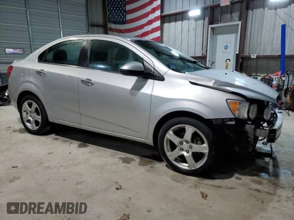 2013 Chevrolet Sonic LTZ with VIN 1G1JE5SH6D4102528, listed as a Copart auction lot 47419475 with 129,812 mi miles and Salvage title. Bid and sale history available at DreamBid. Image 4.