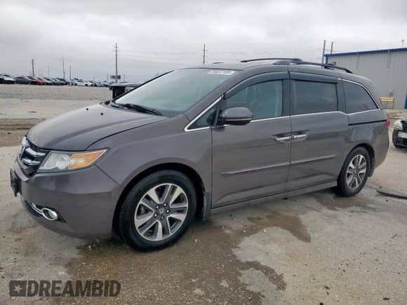 2015 Honda Odyssey Touring Elite с VIN 5FNRL5H96FB082857, выставлен на аукционе Copart как лот 59637105 с пробегом 187 947 миль миль и Списание • Salvage title. История ставок и продаж доступна на DreamBid. Изображение 1.