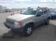 1994 Jeep Grand Cherokee Laredo with VIN 1J4GZ58YXRC325868, listed as a IAAI auction lot 42664900 with 220,149 mi miles and . Bid and sale history available at DreamBid. Image 2.