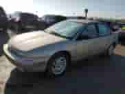 1999 Saturn SL with VIN 1G8ZK5273XZ214036, listed as a Copart auction lot 52038625 with 211,827 mi miles and Salvage title. Bid and sale history available at DreamBid. Image 1.