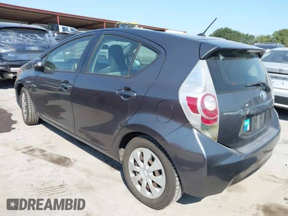 2012 Toyota Prius One z VIN JTDKDTB31C1026286, wystawiony jako IAAI lot #42937931 z przebiegiem 103 470 mil mil oraz . Historia ofert i sprzedaży dostępna na DreamBid. Obrazek 3.