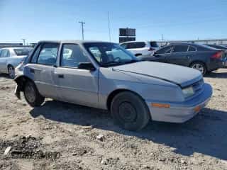 1994 Dodge Shadow with VIN 1B3AP28D5RN193704, listed as a Copart auction lot 82825004 with 90,223 mi miles and Salvage title. Bid and sale history available at DreamBid. Image 4.
