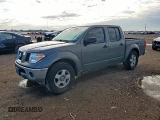 2005 Nissan Frontier SE with VIN 1N6AD07UX5C456141, listed as a Copart auction lot 84018605 with 220,048 mi miles and Salvage title. Bid and sale history available at DreamBid. Image 1.
