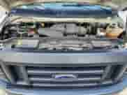 2009 Ford Econoline Cargo Commercial z VIN 1FTNE14W19DA91278, wystawiony jako Copart lot #64551205 z przebiegiem 69 461 mil mil oraz Szkoda całkowita • Salvage title. Historia ofert i sprzedaży dostępna na DreamBid. Obrazek 12.