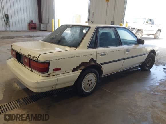 1987 Toyota Camry LE z VIN JT2SV22E7H3174276, wystawiony jako IAAI lot #42609453 z przebiegiem 280 117 mil mil oraz . Historia ofert i sprzedaży dostępna na DreamBid. Obrazek 4.