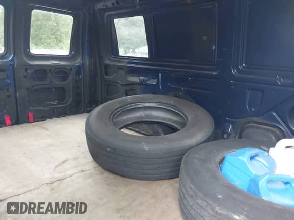 2009 Ford Econoline Cargo Commercial with VIN 1FTNE24W09DA82562, listed as a IAAI auction lot 42701633 with 214,815 mi miles and . Bid and sale history available at DreamBid. Image 8.