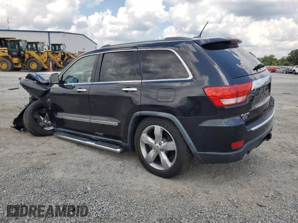 2011 Jeep Grand Cherokee Overland with VIN 1J4RR6GT3BC635757, listed as a Copart auction lot 66867405 with 106,307 mi miles and Salvage title. Bid and sale history available at DreamBid. Image 2.