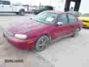 2004 Chevrolet Malibu Classic z VIN 1G1ND52F24M621529, wystawiony jako IAAI lot #41899444 z przebiegiem 166 110 mil mil oraz . Historia ofert i sprzedaży dostępna na DreamBid. Obrazek 2.