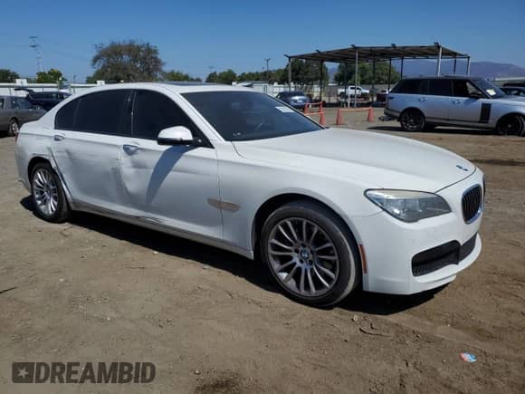 2015 BMW 7 Series with VIN WBAYG6C59FD383685, listed as a Copart auction lot 72630224 with 157,780 mi miles and Salvage title. Bid and sale history available at DreamBid. Image 4.