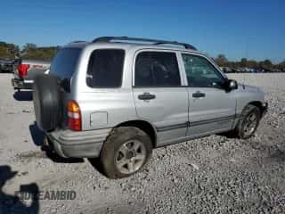 2003 Chevrolet Tracker with VIN 2CNBE13C636908563, listed as a Copart auction lot 76871754 with 205,684 mi miles and Salvage title. Bid and sale history available at DreamBid. Image 3.