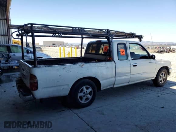 1995 Toyota Tacoma z VIN 4TAUN53B5SZ002480, wystawiony jako Copart lot #71305825 z przebiegiem 467 592 mil mil oraz Szkoda całkowita • Salvage title. Historia ofert i sprzedaży dostępna na DreamBid. Obrazek 3.
