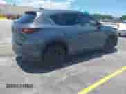 2023 Mazda CX-5 S Carbon Edition z VIN JM3KFBCM2P0200445, wystawiony jako IAAI lot #42745392 z przebiegiem 21 932 mil mil oraz . Historia ofert i sprzedaży dostępna na DreamBid. Obrazek 4.