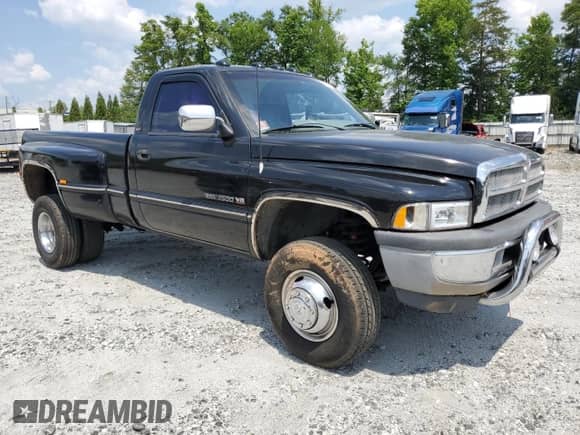 1994 Dodge RAM with VIN 1B7MF3654RS708967, listed as a Copart auction lot 59077115 with 89,023 mi miles and Salvage title. Bid and sale history available at DreamBid. Image 4.