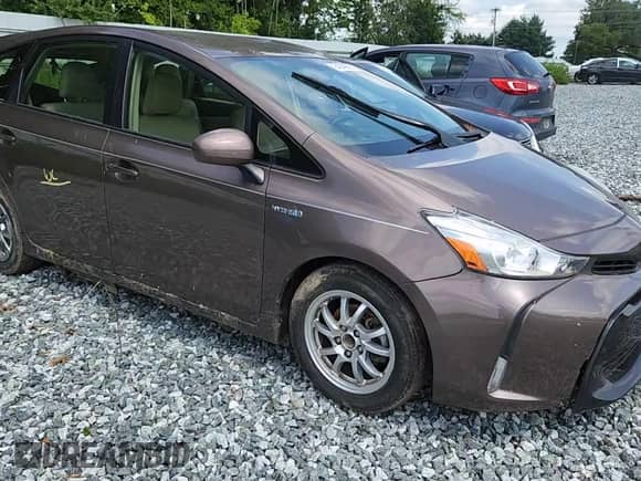 2015 Toyota Prius Two z VIN JTDZN3EU2FJ016273, wystawiony jako Copart lot #64049895 z przebiegiem Nie podano mil oraz Szkoda całkowita • Salvage title. Historia ofert i sprzedaży dostępna na DreamBid. Obrazek 13.