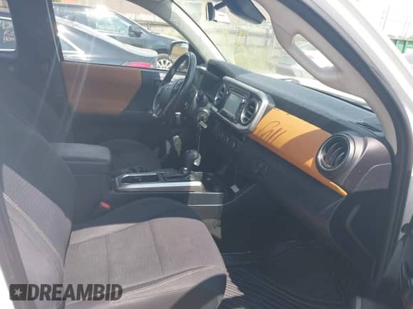 2018 Toyota Tacoma SR with VIN 5TFRX5GN8JX107937, listed as a IAAI auction lot 42940231 with 171,058 mi miles and . Bid and sale history available at DreamBid. Image 5.